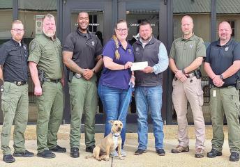 Pictured from left to right: Deputy of Public Relations Mark Pierce, Assistant Warden R.L. Cox, Sgt. Kevin Coleman, Mrs. Barbie Higginbotham, Sheriff Jayson Richardson, Sgt. Mike Armstrong and Deputy Brad Lowe. DPSO bearded program raises funds for charity
