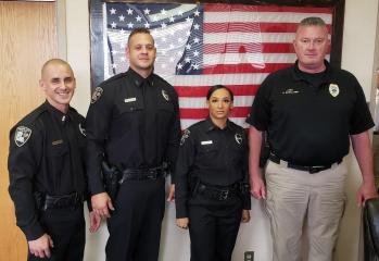 Bossier City Police officers Mathew Welch, Edway Gallier, Jr., and Keandra West with Chief Shane McWilliams.