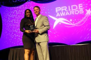 Cherise Sims accepts a 2017 P.R.I.D.E. Award on behalf of The MetroPCS Battle on the Hardwood Classic. The award was presented by Kelly Wells, executive director of the Shreveport-Bossier Sports Commission (right). Article Image Alt Text